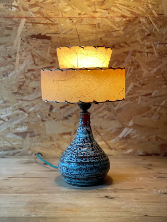 Organic lumpy form lamp with orange pleated shade