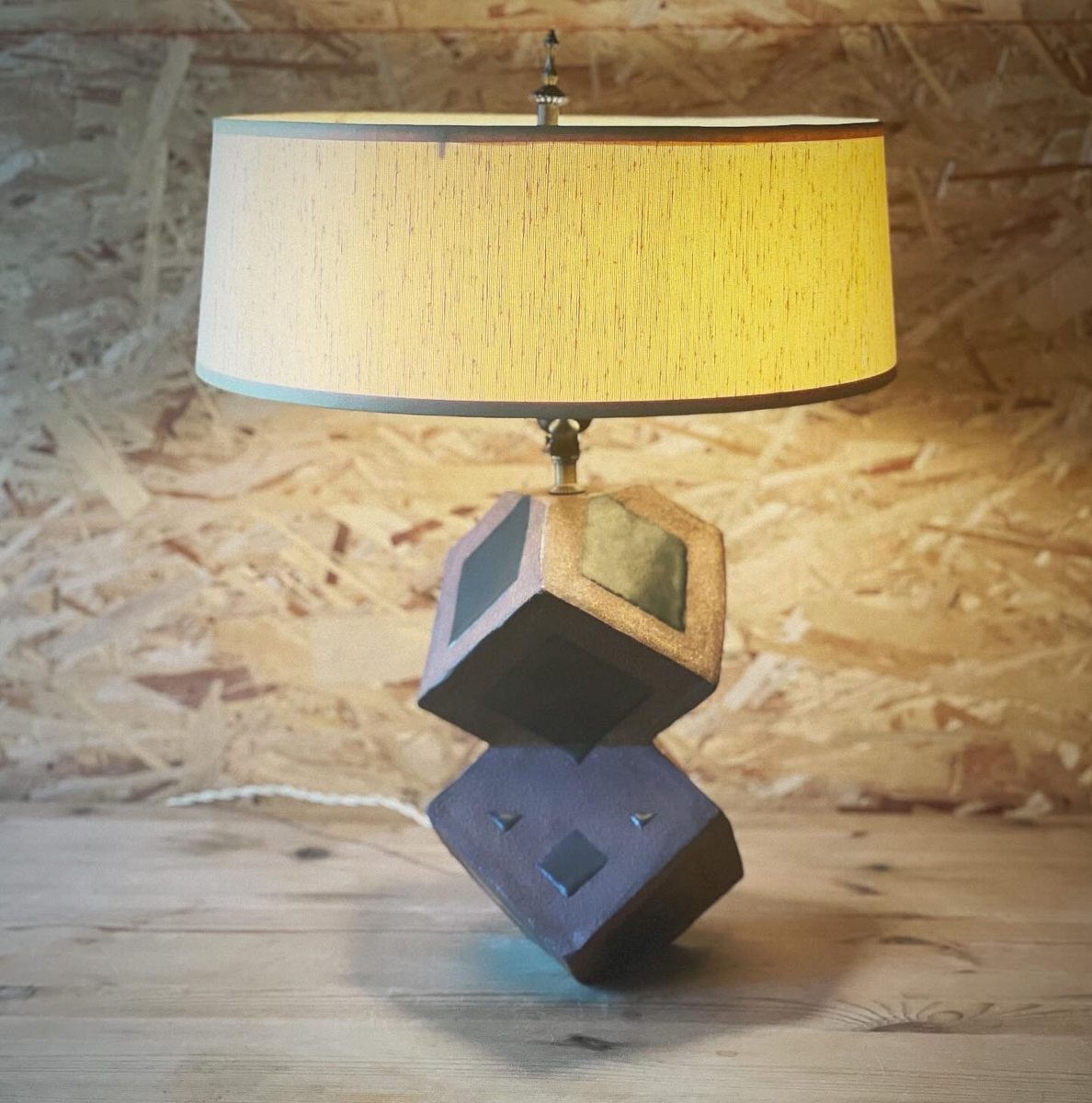 Stacked geometric cube lamp full shot with drum shade