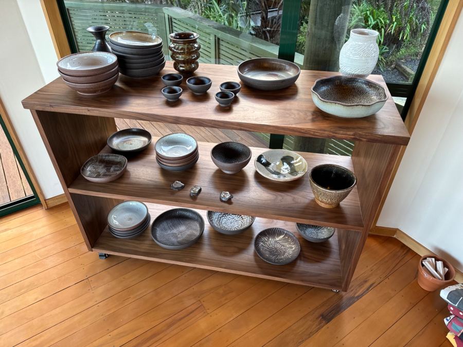 Full shelf display of ceramic collection