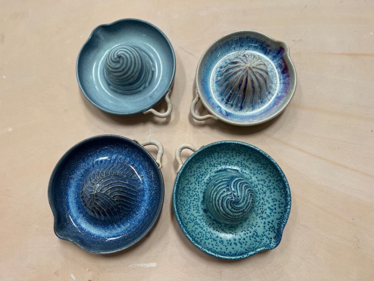 Four ocean blue ceramic citrus reamers